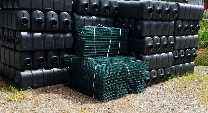  Equipment used for oyster aquaculture is stacked neatly in a driveway. 